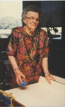 Woman holds an audible ball as she prepares to throw