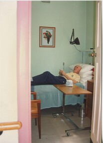Male resident in his single bedroom