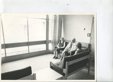 A group of residents sitting inside the George Vowell centre