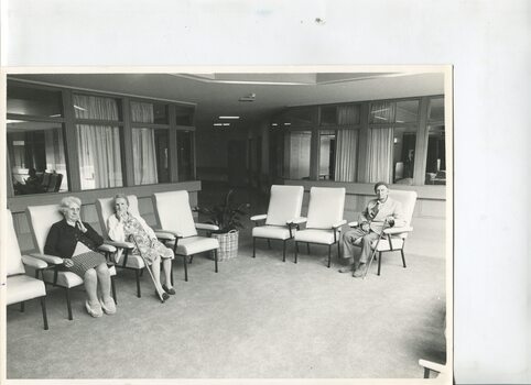 A group of residents sitting inside the George Vowell centre