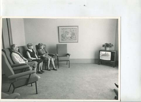 A group of residents sitting inside the George Vowell centre
