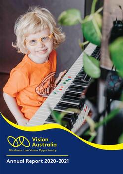 Ollie sits at a piano with tactile markers on some keys