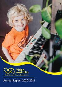 Ollie sits at a piano with tactile markers on some keys