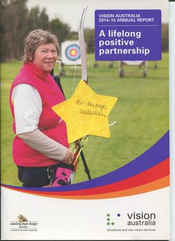 Hazel Hockley stands with her bow and a target in the background