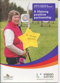 Hazel Hockley stands with her bow and a target in the background