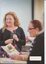Picture of Sarah Boulton chatting with two others out of focus