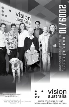 Group of people standing in front of Vision Australia sign with Seeing Eye Dog Max