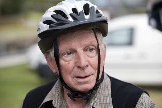 Older man wearing a bike helmet