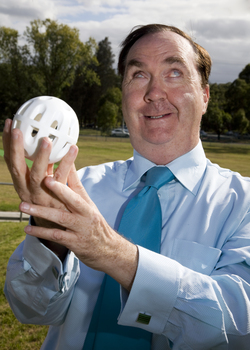 Maurice Gleeson holding an audible ball used in blind cricket