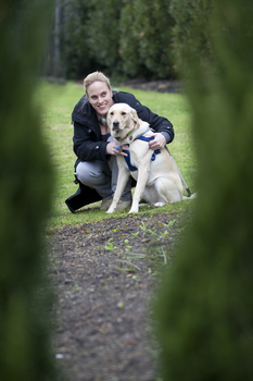Penny Stevenson with her dog guide at Kooyong