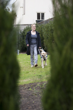 Penny Stevenson with her dog guide at Kooyong