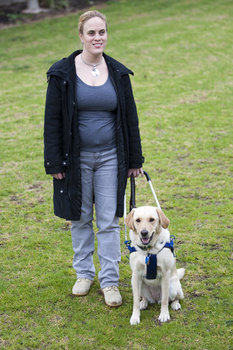 Penny Stevenson with her dog guide at Kooyong