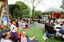 Families sitting on lawn watching official launch of Feelix in rotunda