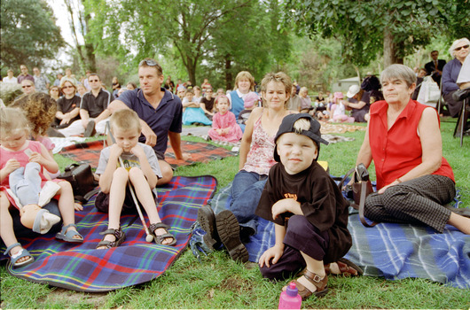 Families sitting on lawn watching official launch of Feelix in rotunda