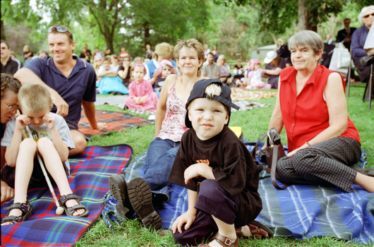 Families sitting on lawn watching official launch of Feelix in rotunda