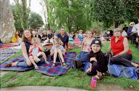 Families sitting on lawn watching official launch of Feelix in rotunda