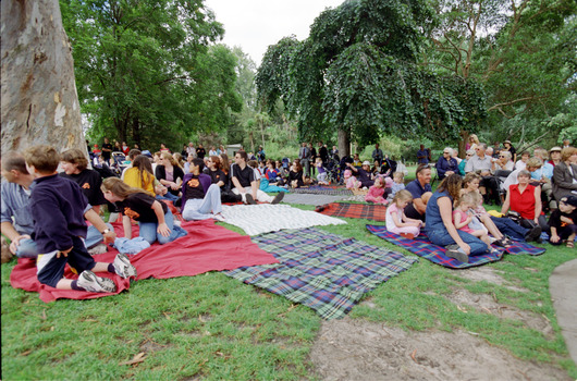 Families sitting on lawn watching official launch of Feelix in rotunda