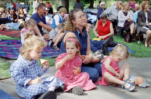 Families sitting on lawn watching official launch of Feelix in rotunda