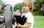 Children hold items from Feelix kits during the official launch at Melbourne Zoo