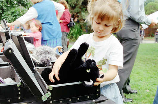 Children hold items from Feelix kits during the official launch at Melbourne Zoo