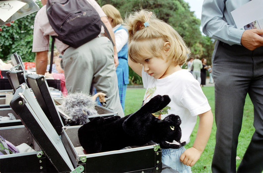 Children hold items from Feelix kits during the official launch at Melbourne Zoo