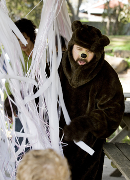 Bear (Ed Gamble) and the children on the Bear Hunt