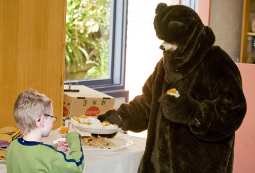 Bear having morning tea with children 