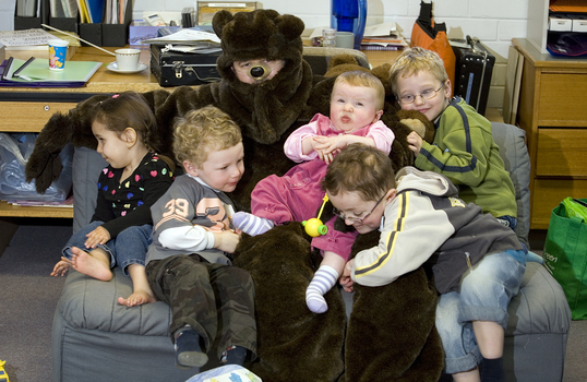 Bear (Ed Gamble) and the children on the Bear Hunt