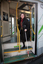 Renee disembarking from a tram with her white cane