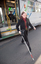 Renee disembarking from a tram with her white cane