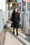 Renee crossing the train tracks at Kooyong station using her white cane