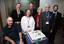 ?, Gerard Menses, Lynne Kells, Tim Evans, Roberta Ashby, Stephen Jolley and ? with 25th anniversary cake