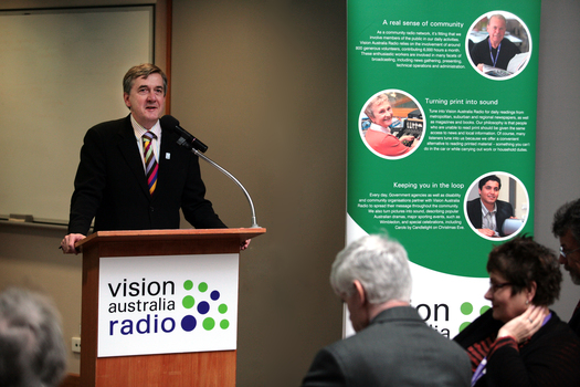 Gerard Menses at the podium for the 25th Anniversary of Vision Australia Radio