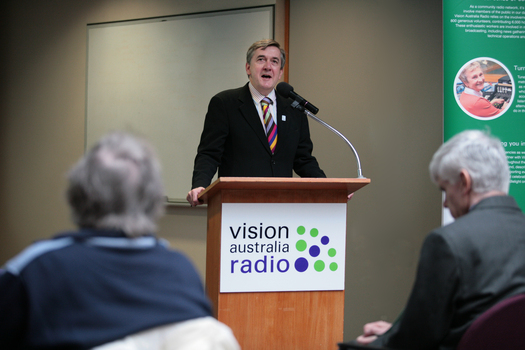 Gerard Menses at the podium for the 25th Anniversary of Vision Australia Radio
