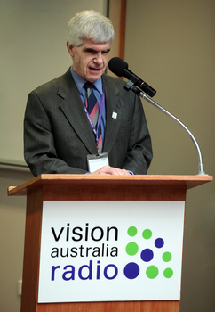 Stephen Jolley at the podium for the 25th Anniversary of Vision Australia Radio