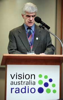 Stephen Jolley at the podium for the 25th Anniversary of Vision Australia Radio