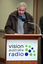 Norm Rees at the podium for the 25th Anniversary of Vision Australia Radio