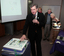 Gerard Menses and cake made for the 25th Anniversary of Vision Australia Radio