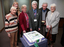 Pam Adams, Roberta Ashby, Stephen Jolley , Norm Rees and female with cake made for the 25th Anniversary of Vision Australia Radio