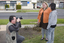 Photographer taking pictures of Jenny and Trudy outside Essendon office
