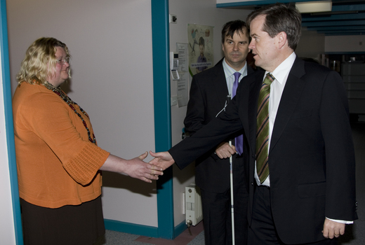 Trudy Ryall shakes Bill Shorten's hand as Chris Edwards looks on