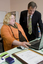 Trudy Ryall speaking with Bill Shorten as she demonstrates something on a computer