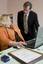 Trudy Ryall speaking with Bill Shorten as she demonstrates something on a computer