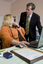 Trudy Ryall speaking with Bill Shorten as she demonstrates something on a computer