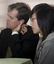 Jenny Tran and Bill Shorten listen to another speaker