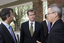 Bill Shorten speaking with Chris Edwards and unidentified man