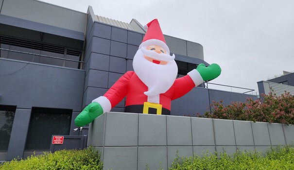 Close up view of large inflatable Santa facing Glenferrie Road