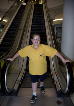 Richard Carbone leaving descending escalator