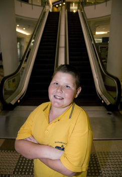 Richard Carbone stands in front of escalators