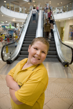 Richard Carbone stands in front of escalators